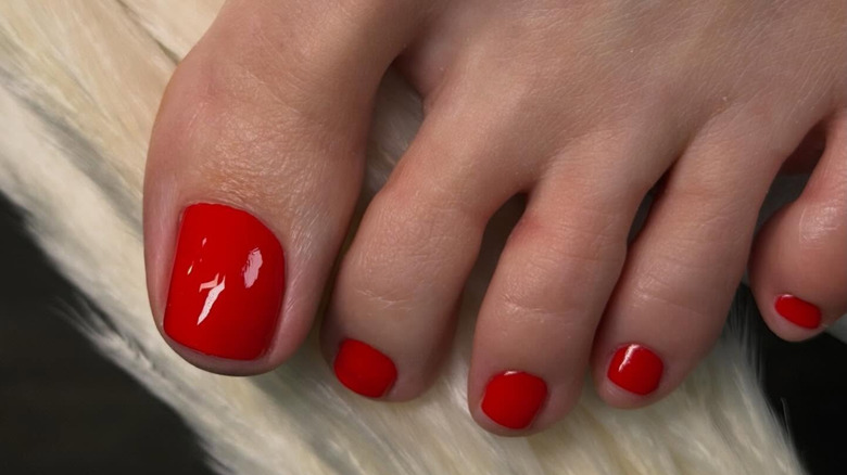 Classic red pedicure by Maryna Slynko