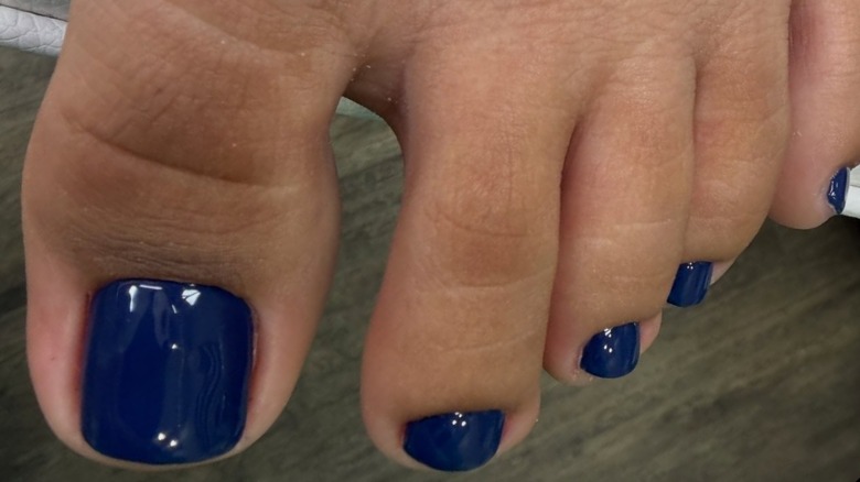 Deep sapphire blue pedicure by Maryna Slynko