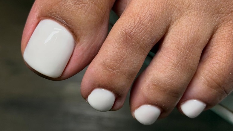Milky white pedicure by Maryna Slynko