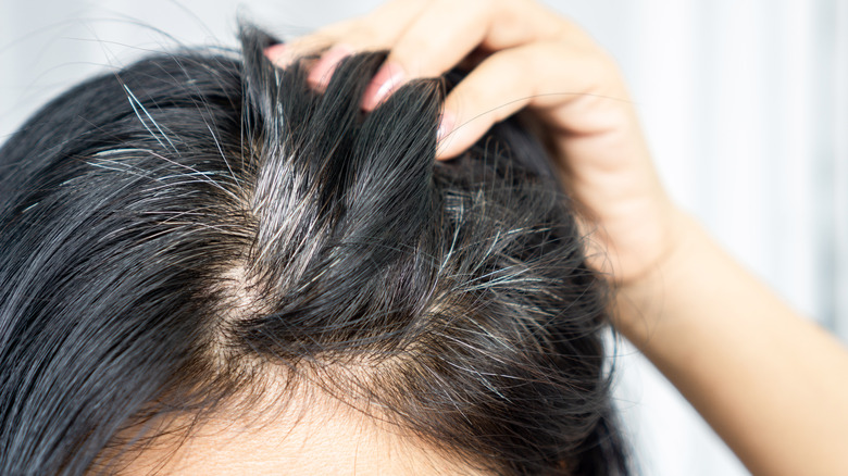 woman with grey roots
