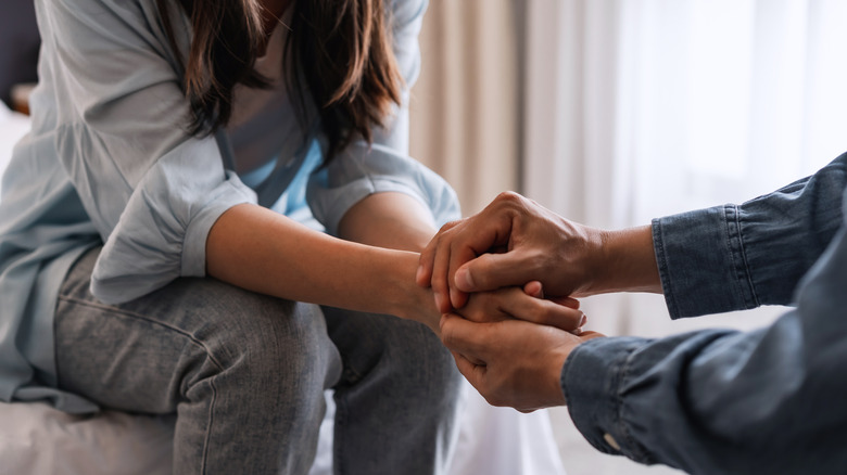 Couple holding hands