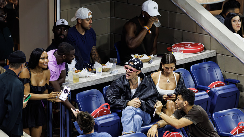 Justin and Hailey Bieber are joined by Frances Tiafoe to watch Coco Gauff of the United States play against Elise Mertens of Belgium in the third round of the US Open at the USTA Billie Jean King National Tennis Center on September 01, 2023 in New York City
