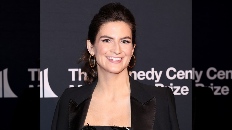 Kaitlan Collins at smiling for a photo at the Kennedy Center