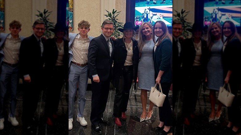 Kelly and Mike Johnson posing with singer Lainey Wilson