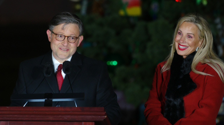 Mike Johnson alongside his wife, Kelly, in December 2025