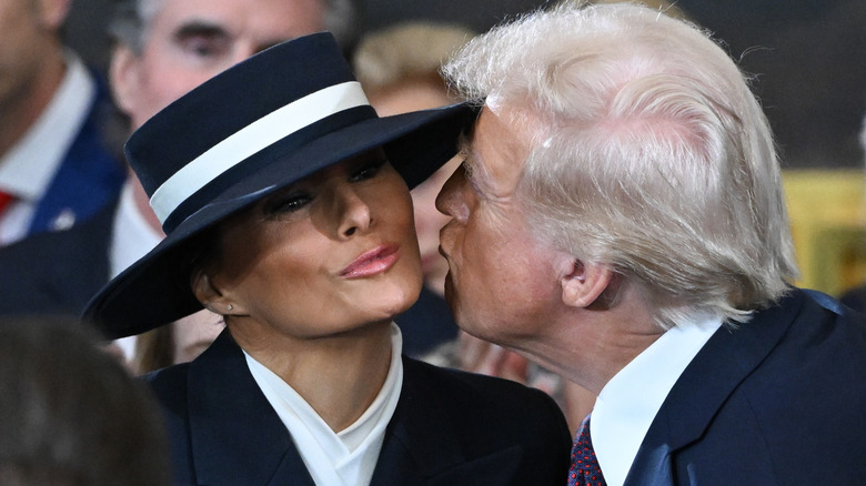 Donald Trump kisses Melania Trump at his inauguration in the U.S. Capitol Rotunda on January 20, 2025