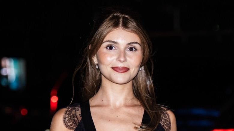 Olivia Jade attends the Chanel Party in a black dress with lace