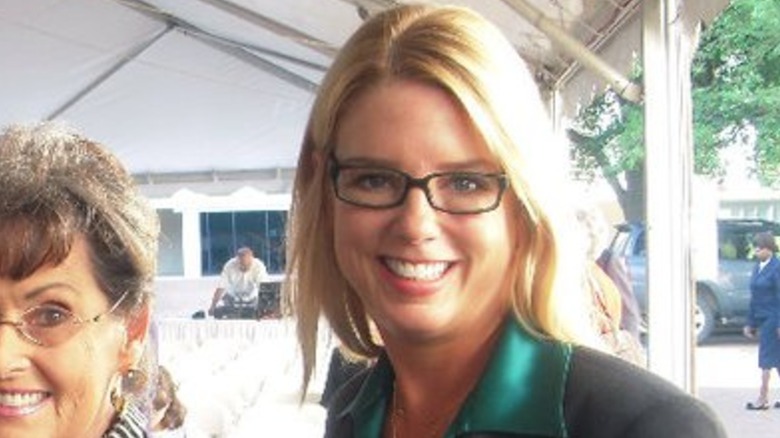 Pam Bondi with minimal makeup and glasses