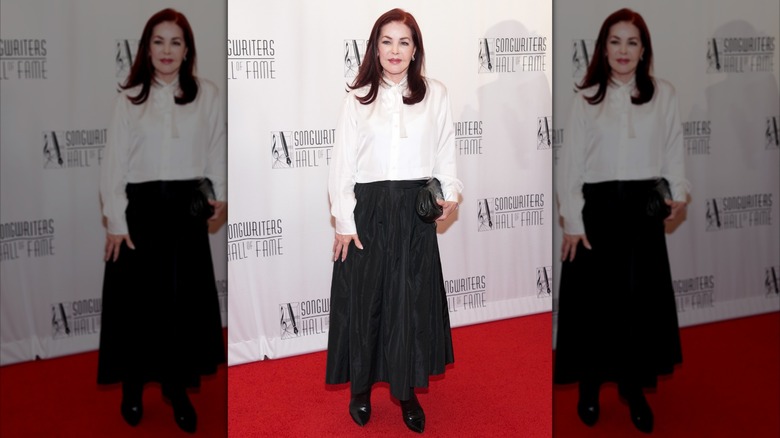 Priscilla Presley wearing a blouse and ankle-length skirt for a 2024 event