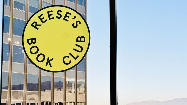The Reese's Book Club sign on the window of Reese's Book Club Experience at Shine Away 2025