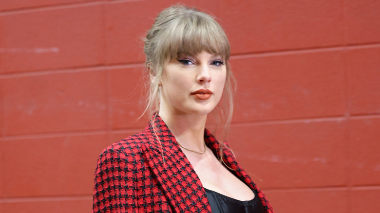 Taylor Swift in a black and red blazer