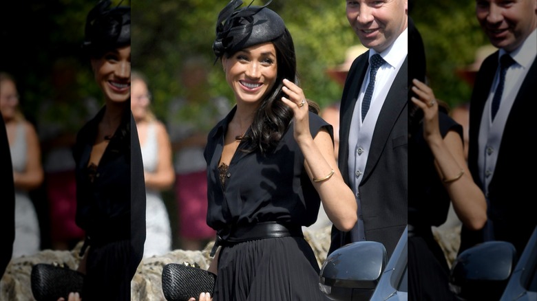 Meghan Markle smiling and waving