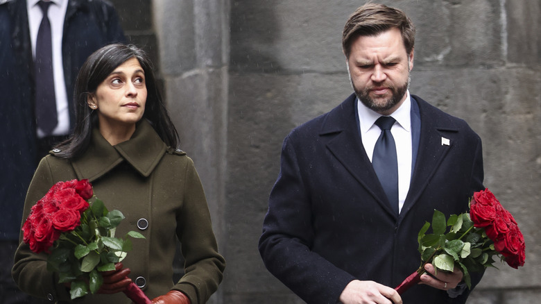 JD Vance and wife Usha Vance hold flowers as they walk to the Eternal Flame during a visit to the Tsitsernakaberd Armenian Genocide Memorial, 2026