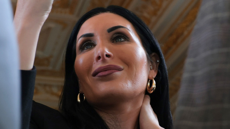 Laura Loomer taking a photo