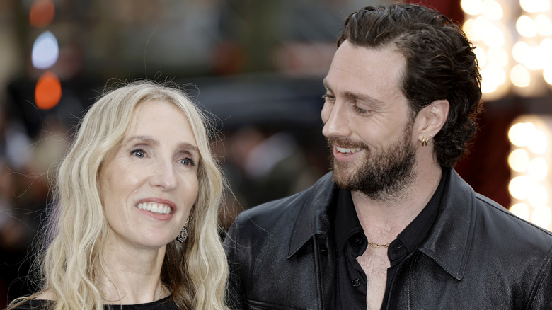 Sam Taylor-Johnson smiles as Aaron Taylor-Johnson looks at her