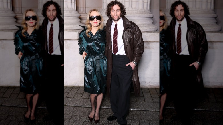 Sam Taylor-Johnson wears huge sunglasses next to Aaron Taylor-Johnson wearing a shirt and tie