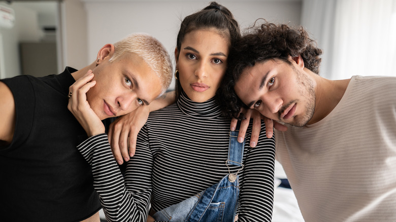 polyamorous man with two women