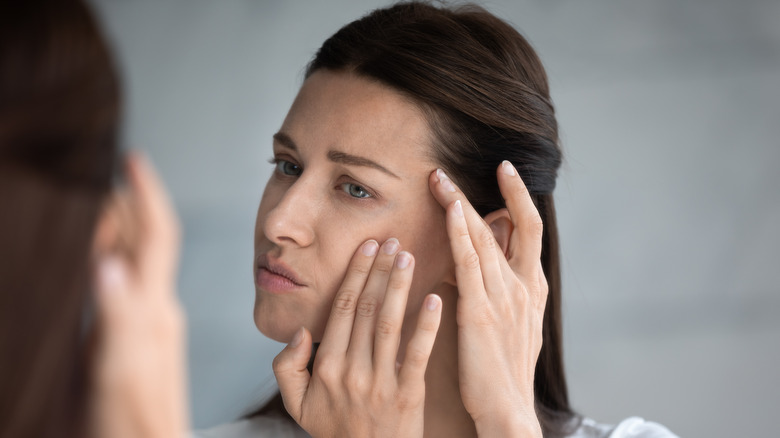 Woman looking in mirror