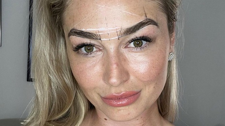 Woman having her eyebrows done