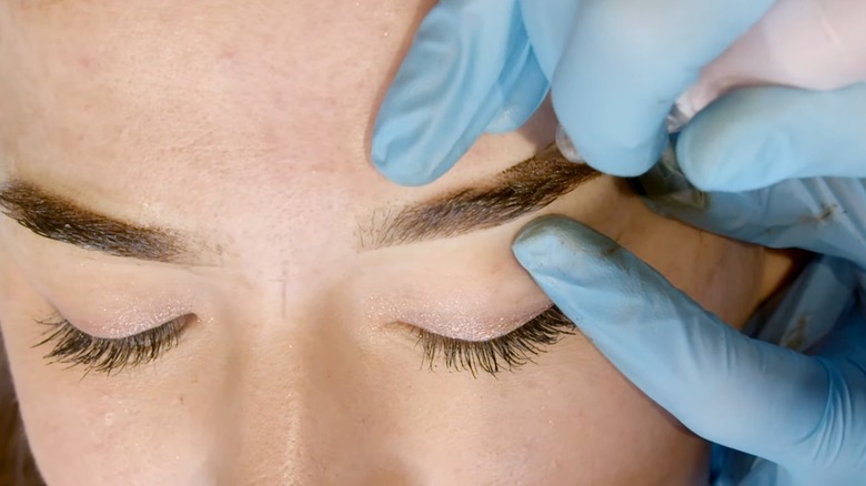 Woman getting powder brows