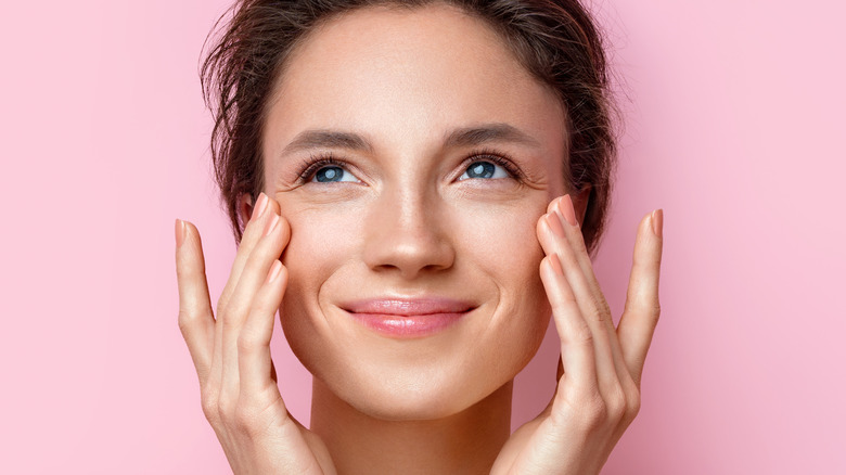 Woman applying petroleum jelly