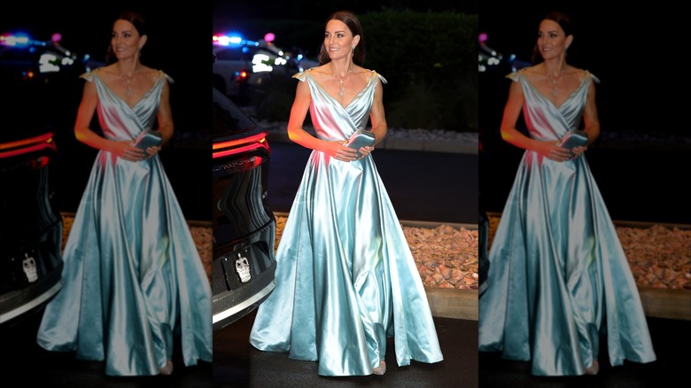 Kate Middleton wearing a light blue ball gown while arriving at a Governor-General-hosted reception in the Bahamas