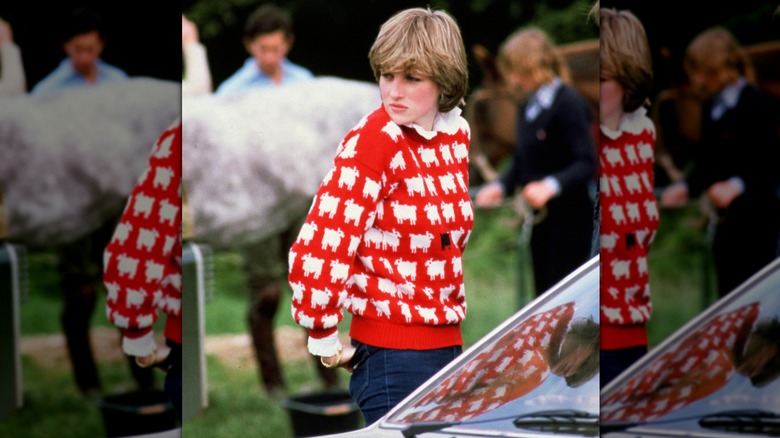 Princess Diana wearing a red sweater with white sheep and one black sheep on it in June 1981