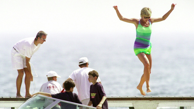 Princess Diana jumping on a boat in St. Tropez in July 1997
