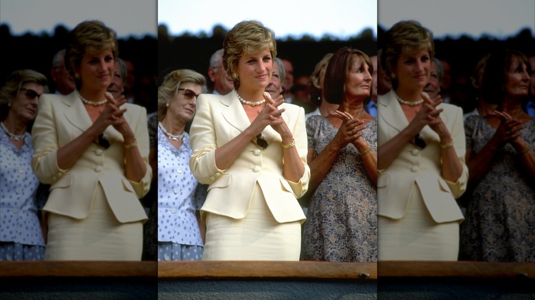 Princess Diana in the stands at Wimbledon wearing a pale yellow suit