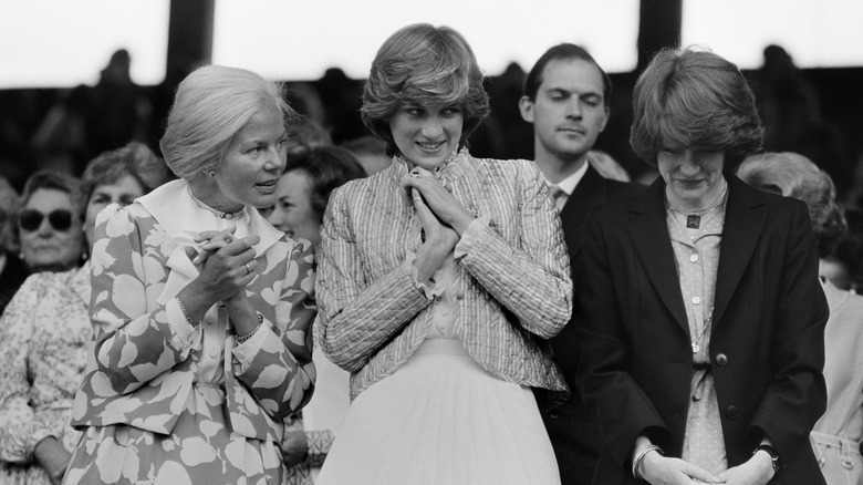 Princess Diana in the stands at Wimbledon in a quilted jacket and dress