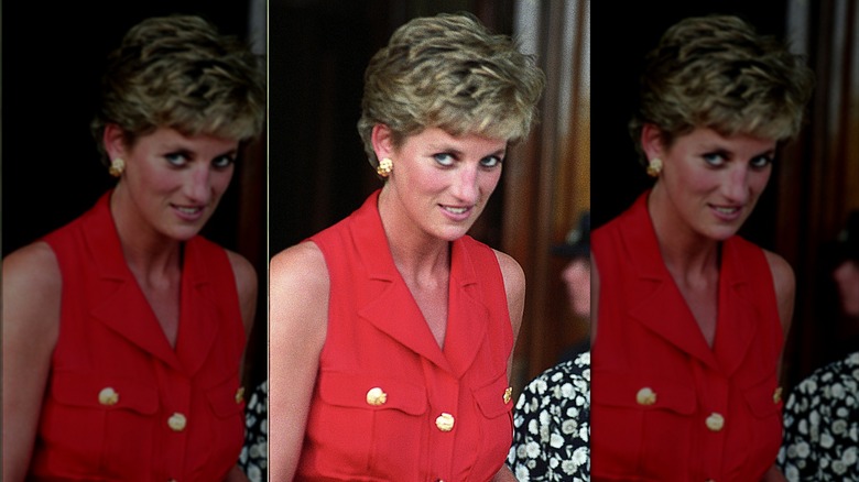 Princess Diana wearing a sleeveless red dress with gold buttons