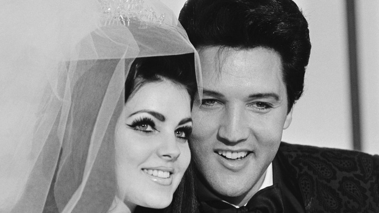 Priscilla and Elvis Presley smile on their wedding day