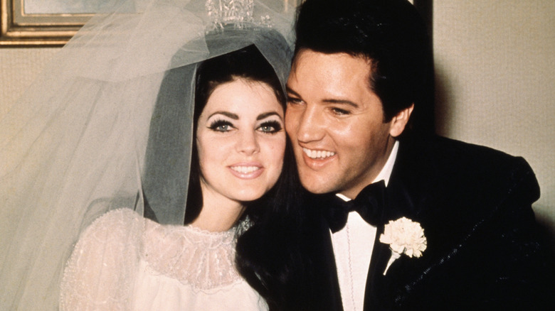 Priscilla and Elvis Presley smiling on their wedding day