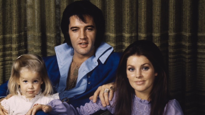 Lisa Marie Presley, Elvis Presley and Priscilla Presley pose for a family photo