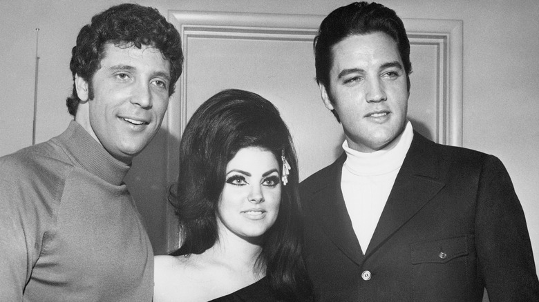 Tom Jones, Priscilla Presley, and Elvis Presley pose for a photo