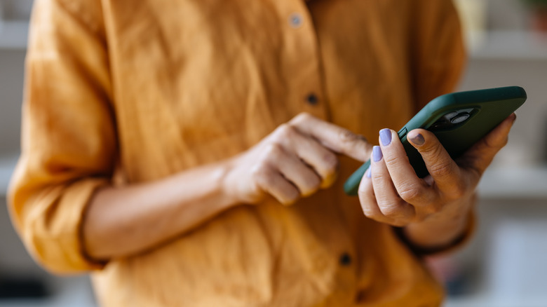 Hands holding phone