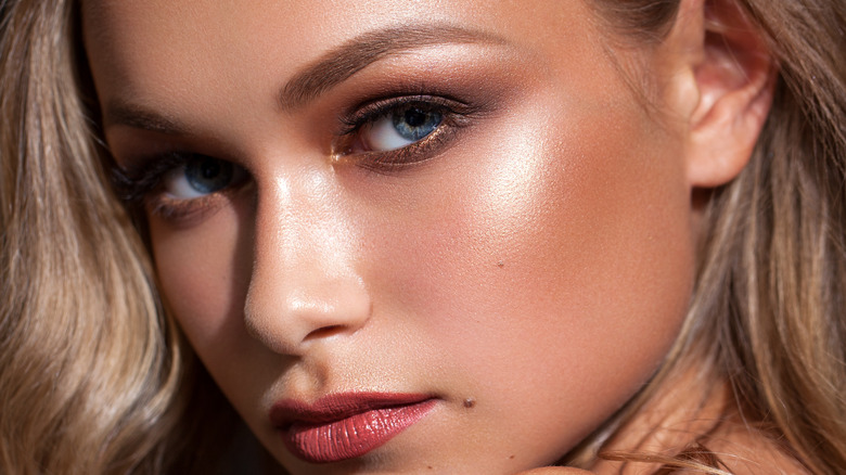 Closeup of woman's bronzer-based makeup
