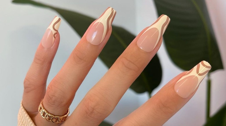 Light yellow and brown manicure
