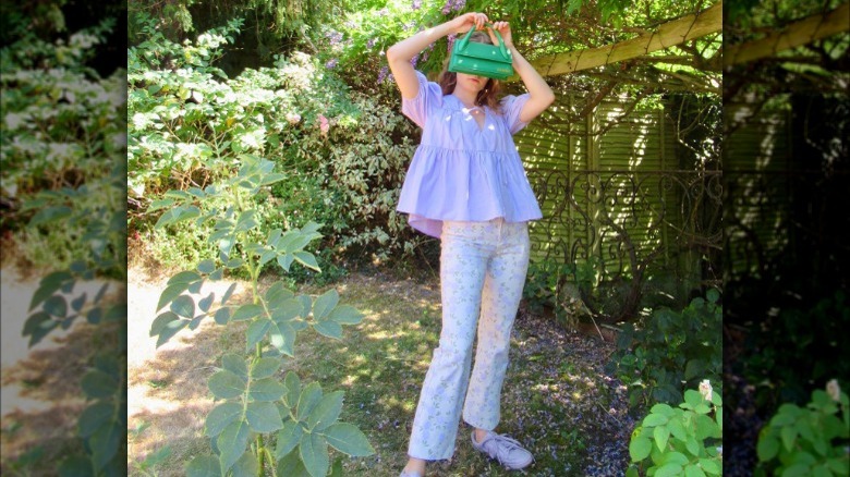 Woman in blouse and floral pants