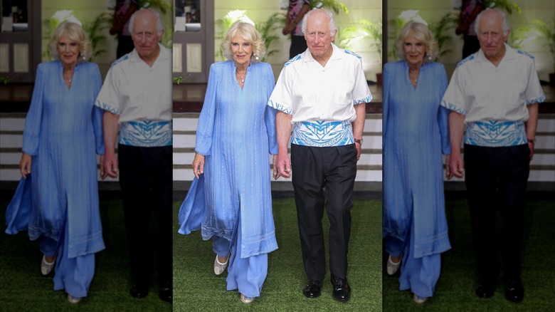 King Charles III and Queen Camilla walking together at the CHOGM Reception & Dinner at the Robert Louis Stevenson Museum on October 25, 2024 in Apia, Samoa
