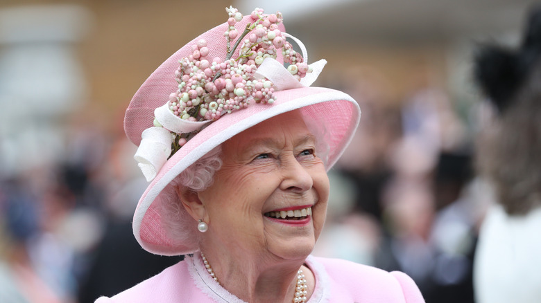 Queen Elizabeth II pictured smiling in 2019