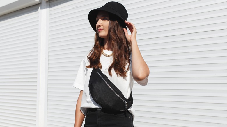 woman bucket hat and fanny pack