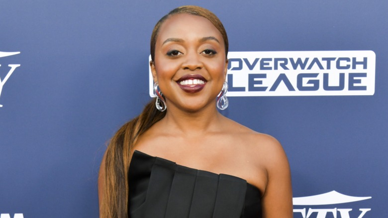Quinta Brunson smiling on the red carpet in 2019