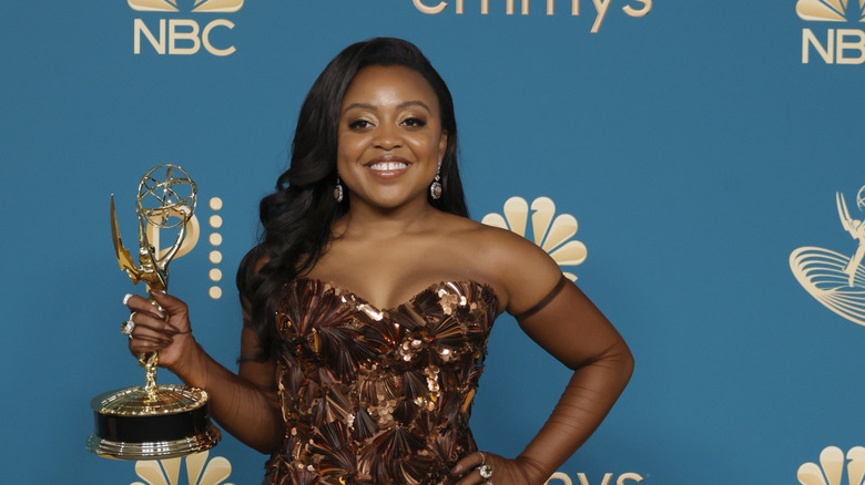 Quinta Brunson holding her Emmy at the 2022 ceremony