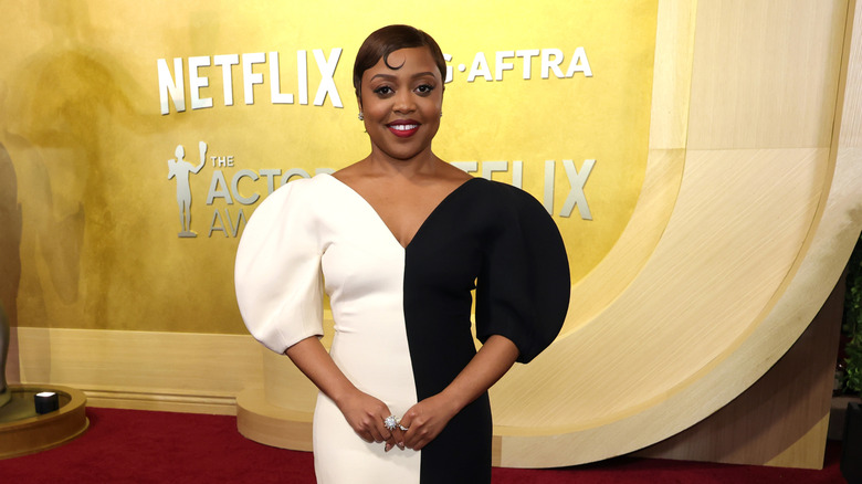 Quinta Brunson wearing a black-and-white dress on the red carpet in 2026