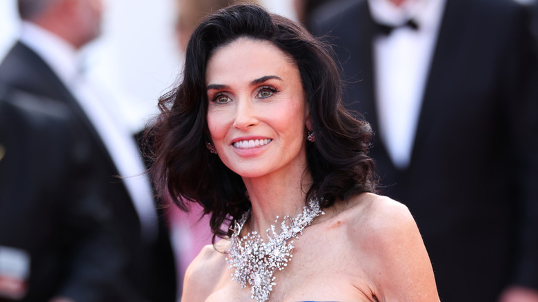 Demi Moore smiles on the red carpet in 2026