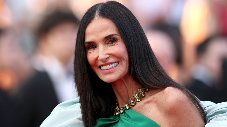 Demi Moore smiles on the red carpet in 2026
