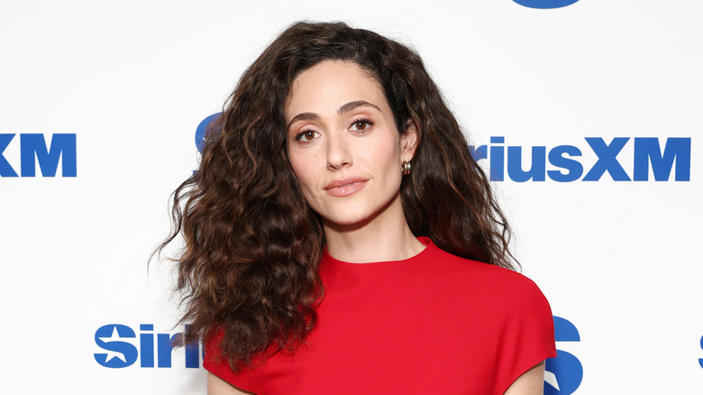 Emmy Rossum smiles on the red carpet in 2026