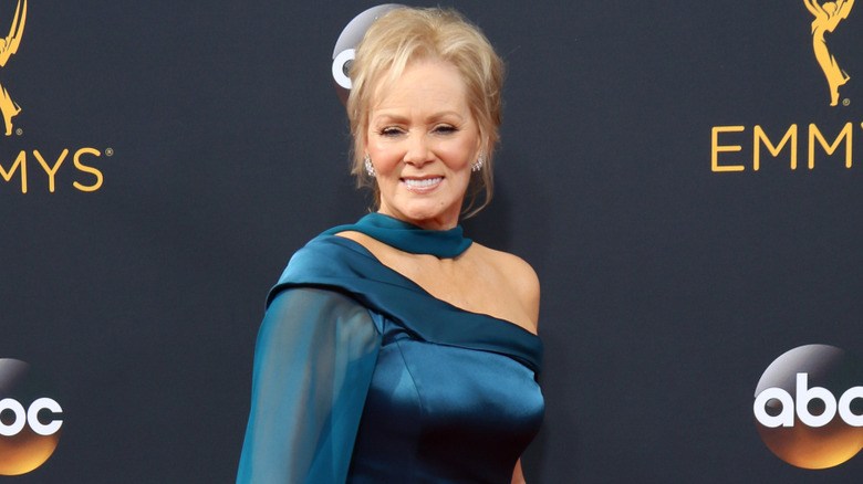 Jean Smart in a blue gown with an off-the-shoulder detail