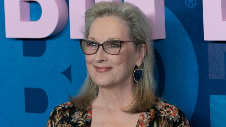 Meryl Streep on the red carpet wearing glasses